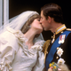 Britain's Prince Charles kisses his bride, the former Diana Spencer, on the balcony of Buckingham Palace in London, after their wedding on July 29, 1981. (AP Photo)